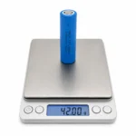 THOR 3.2V 1500mAh 18650 LiFePO4 battery cell on a digital scale showing 42.00 g