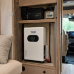 THOR Power 2560Wh LiFePO4 battery installed in an RV electrical cabinet with inverter and DC wiring